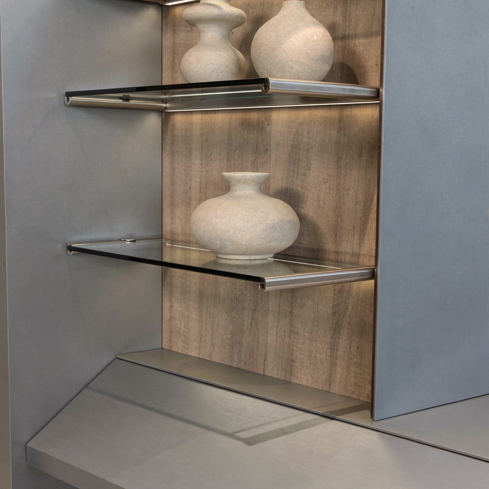Longform media-wall glass display shelf detail